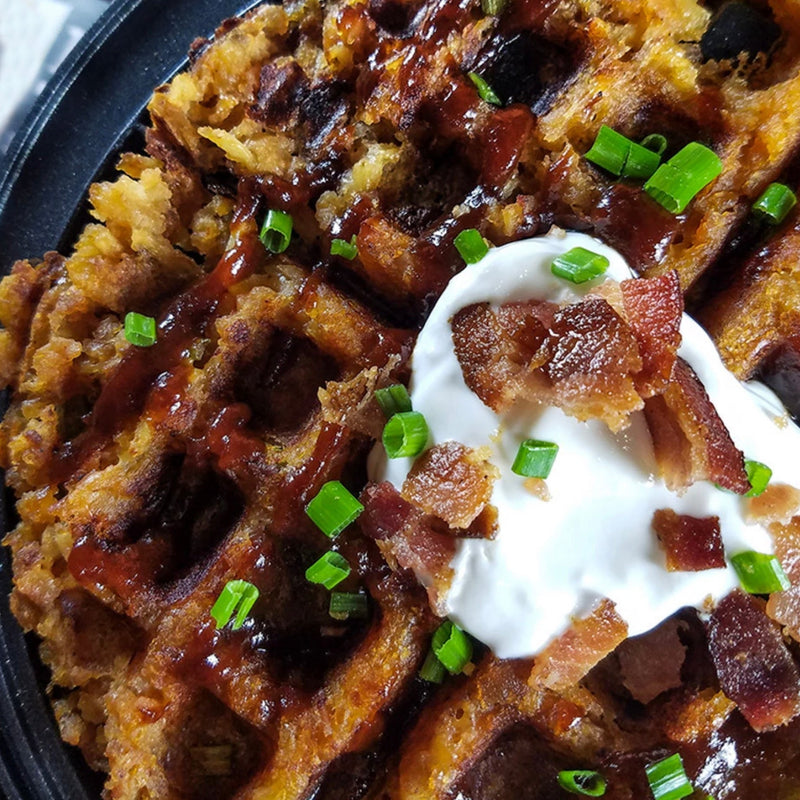 waffle covered in sour cream and bacon